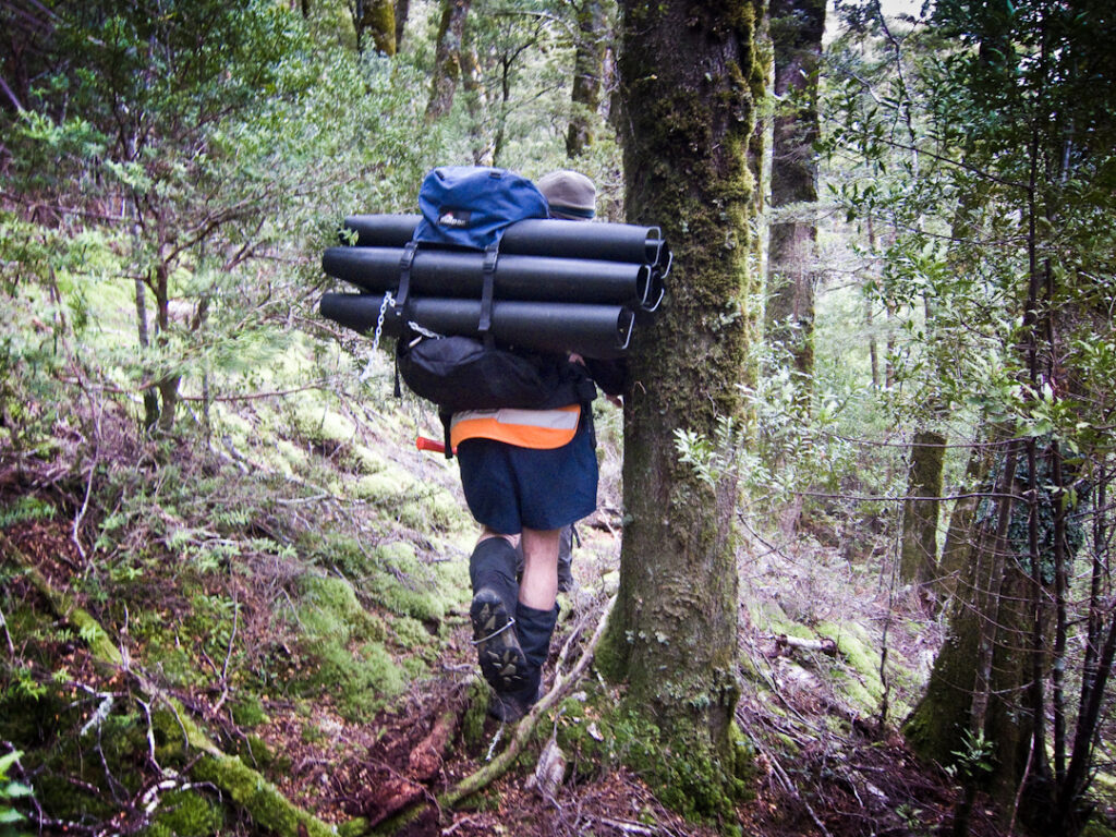 A person carrying tracking tunnels