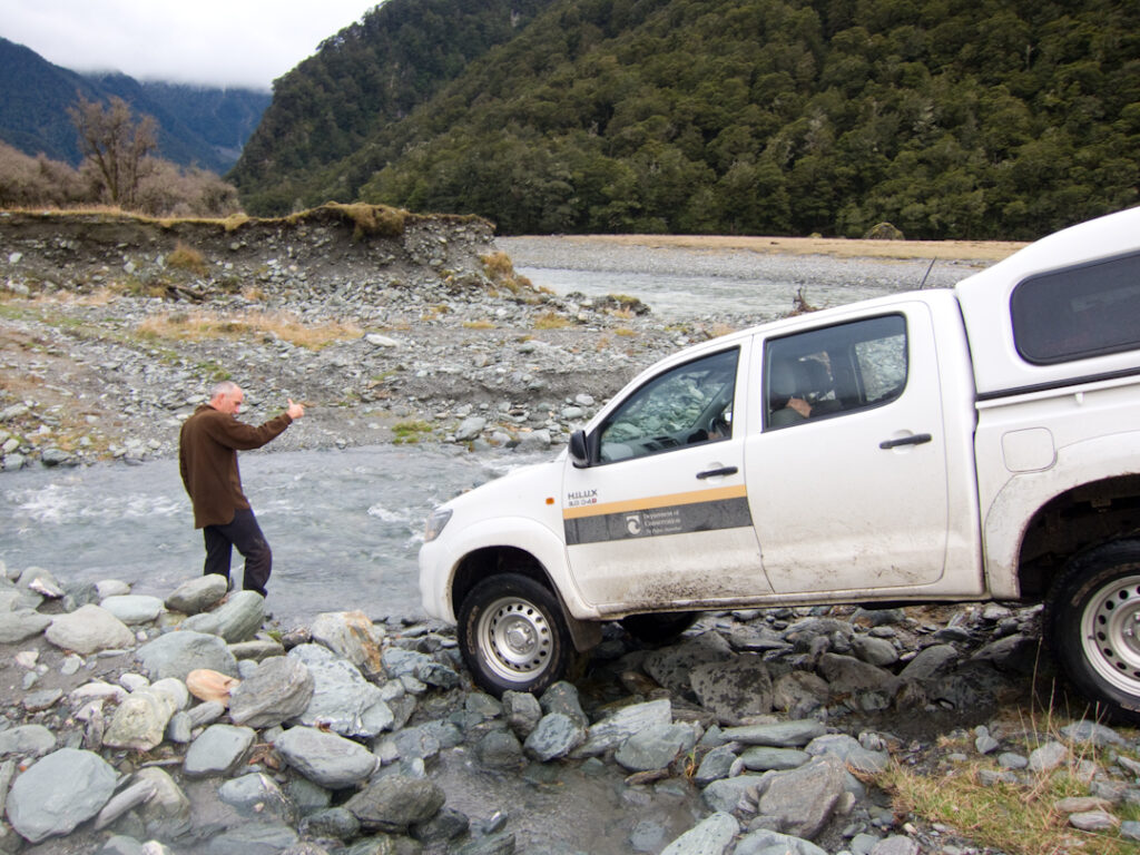 DOC 4wd negotiating a rough creek bed and ford