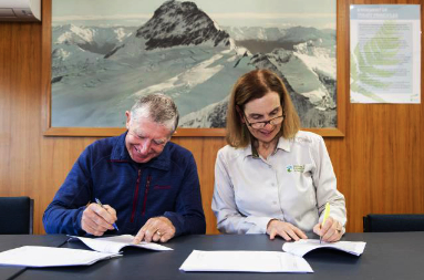 Derek Crombie (MCT) and Nikki Holmes (DOC) signing the Management Agreement